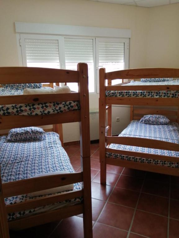 Postel nebo postele na pokoji v ubytování Albergue La Pinilla