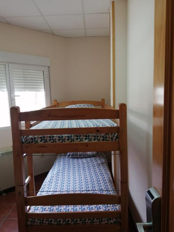 Postel nebo postele na pokoji v ubytování Albergue La Pinilla