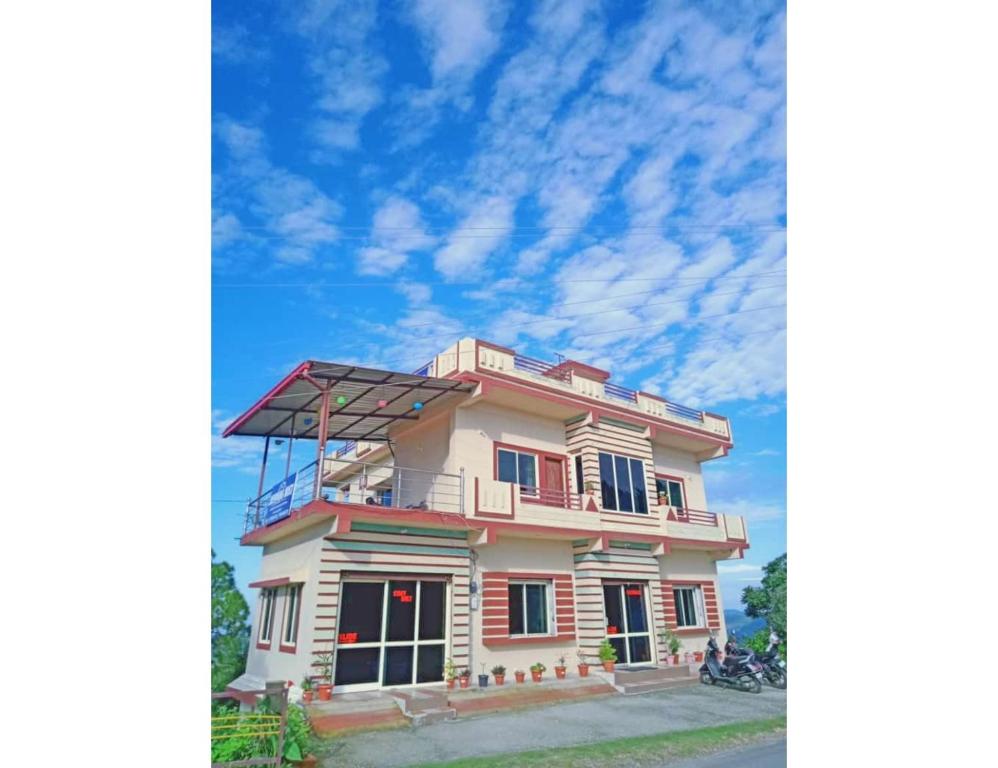 a house with a solar panel on top of it at Morning Mist Homestay, Lansdowne in Lansdowne