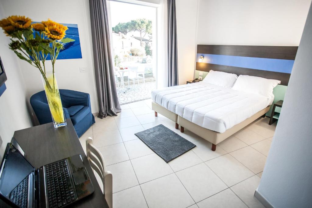 Postel nebo postele na pokoji v ubytování Hotel Oceanomare