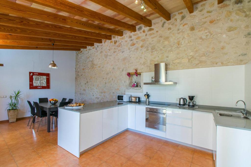 A kitchen or kitchenette at Finca SERA Caimari by Mallorca Villa Selection