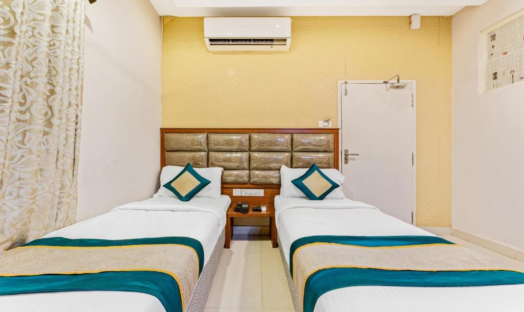 Postel nebo postele na pokoji v ubytování Pine Tree Boutique Hotel