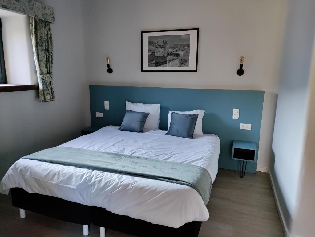 Postel nebo postele na pokoji v ubytování Hotel Le Moulin Des Ramiers