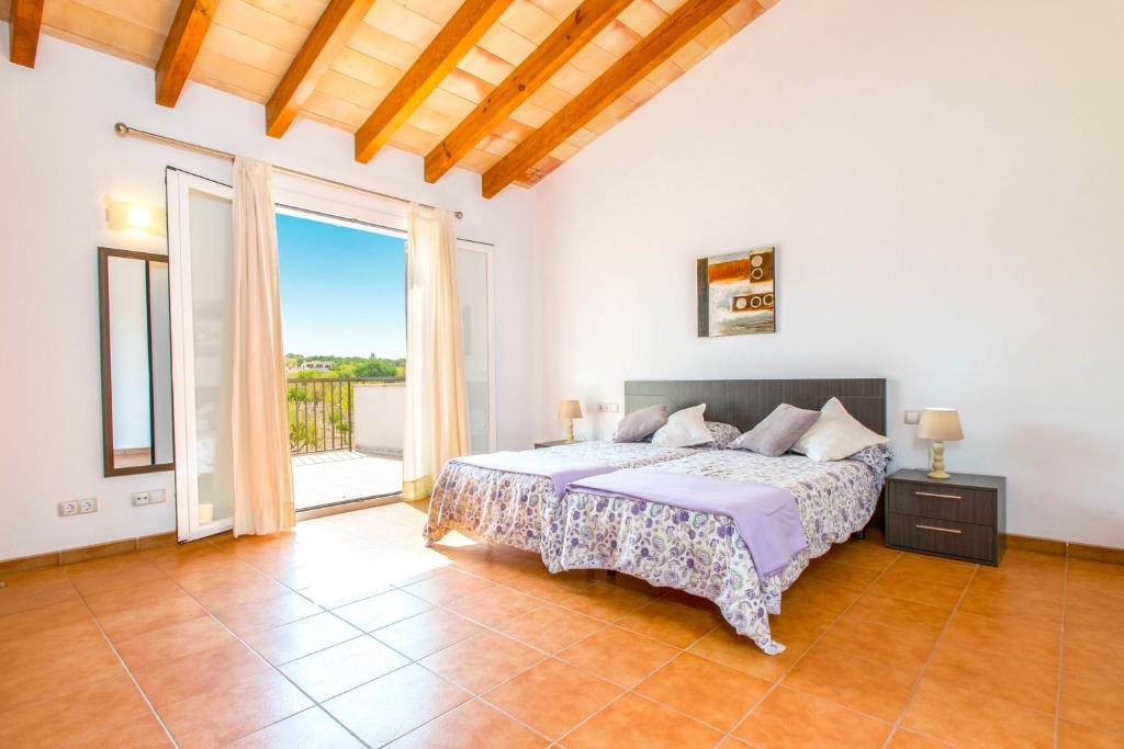 A bed or beds in a room at Finca SERA Caimari by Mallorca Villa Selection