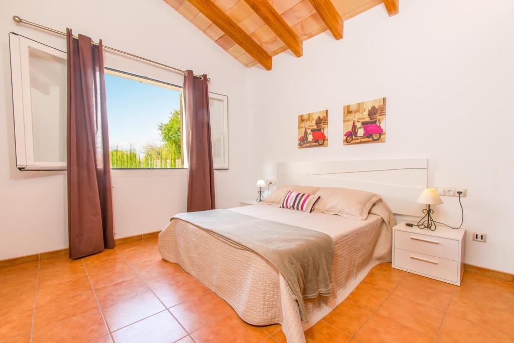 A bed or beds in a room at Finca SERA Caimari by Mallorca Villa Selection