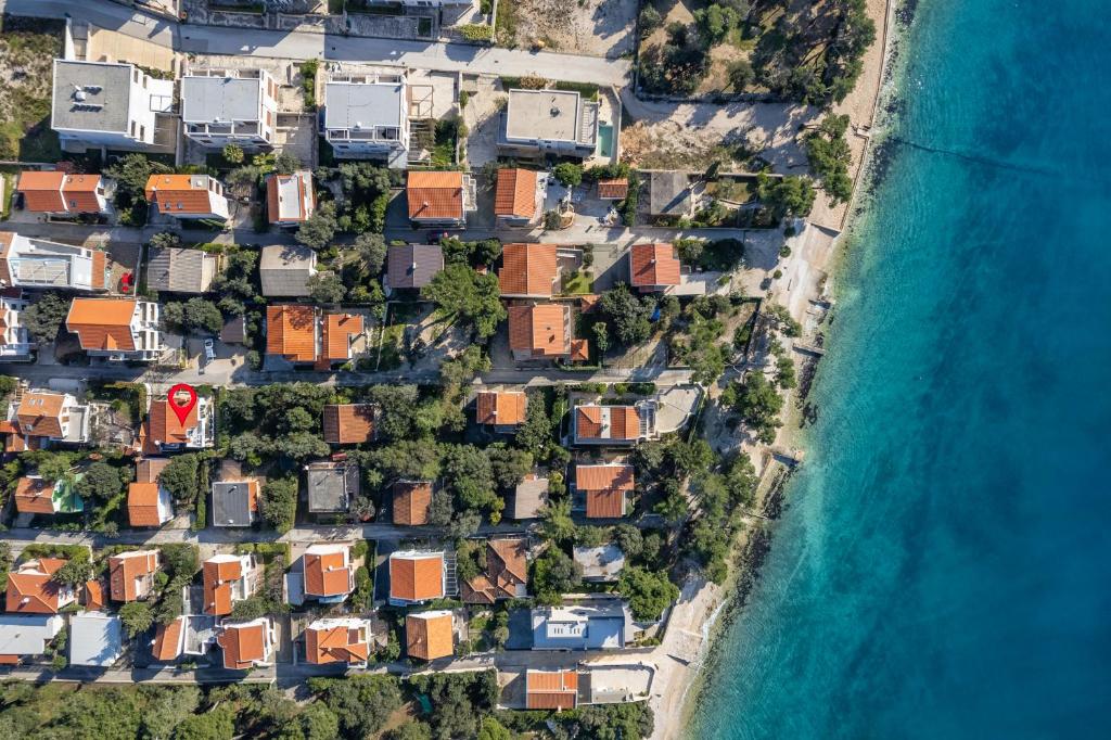 an aerial view of houses next to the ocean at Villa Abbalina in Petrcane