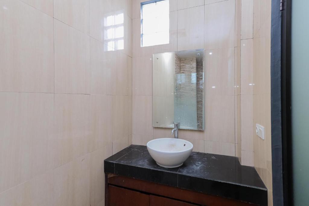 Koupelna v ubytování Urbanview Hotel WG Jimbaran Bali