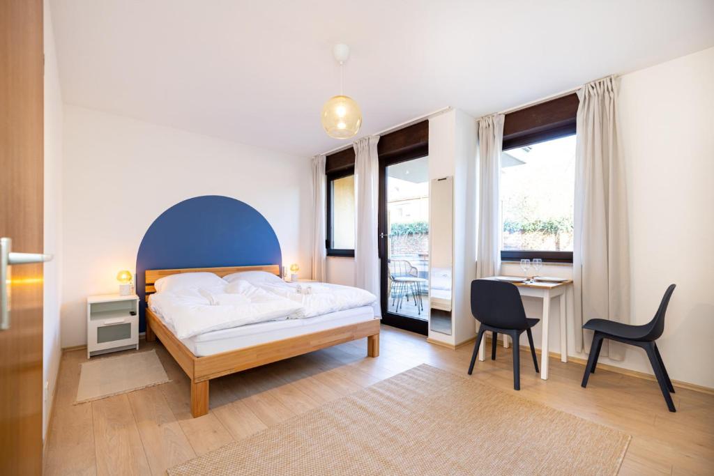 Postel nebo postele na pokoji v ubytování Nette Apartments mit Terrasse