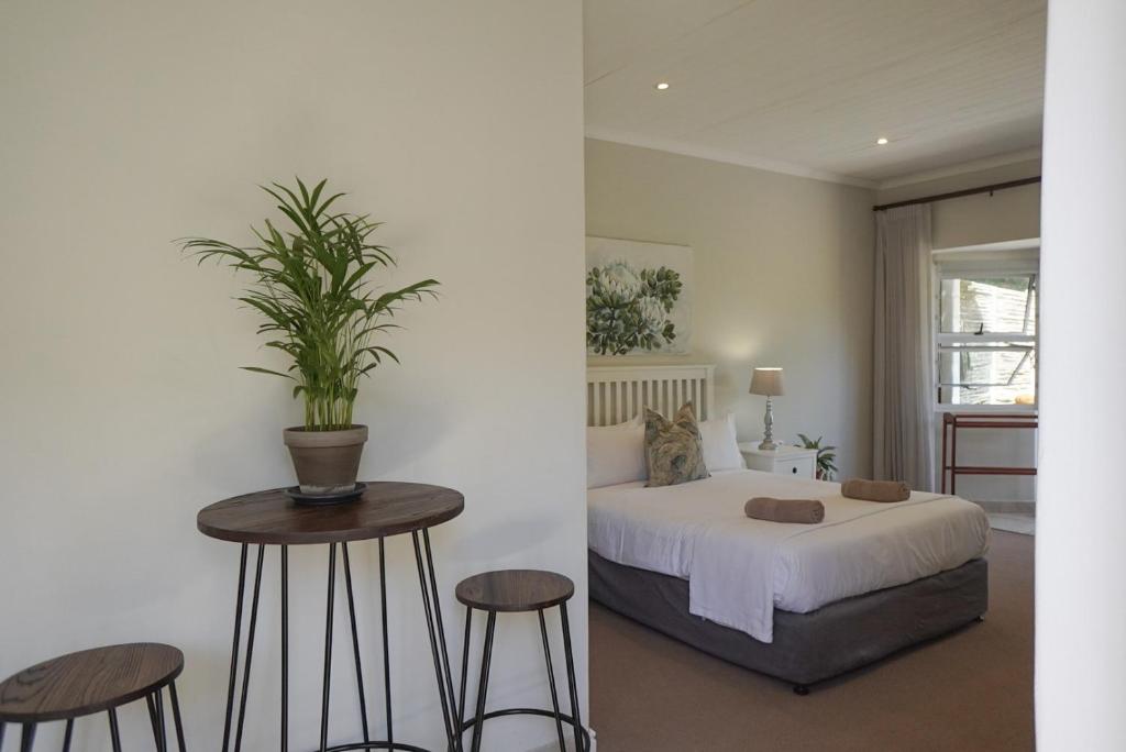 Ένα ή περισσότερα κρεβάτια σε δωμάτιο στο Panzi Garden Suite