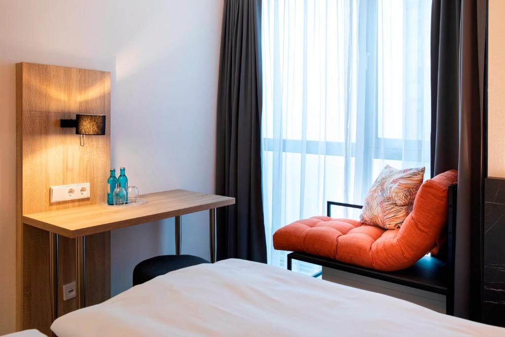 Postel nebo postele na pokoji v ubytování ACHAT Hotel Stuttgart Airport Messe