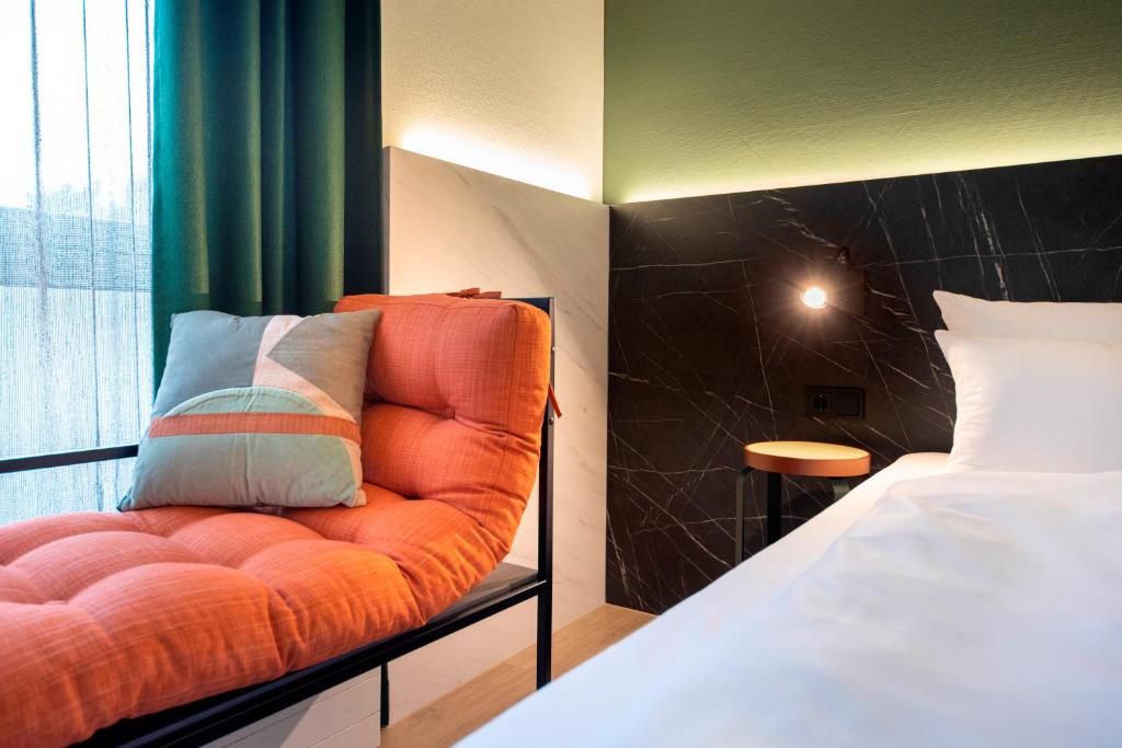 Postel nebo postele na pokoji v ubytování ACHAT Hotel Stuttgart Airport Messe