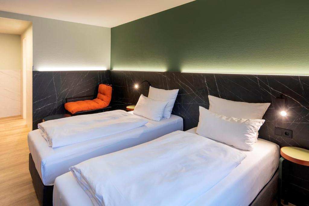 Postel nebo postele na pokoji v ubytování ACHAT Hotel Stuttgart Airport Messe