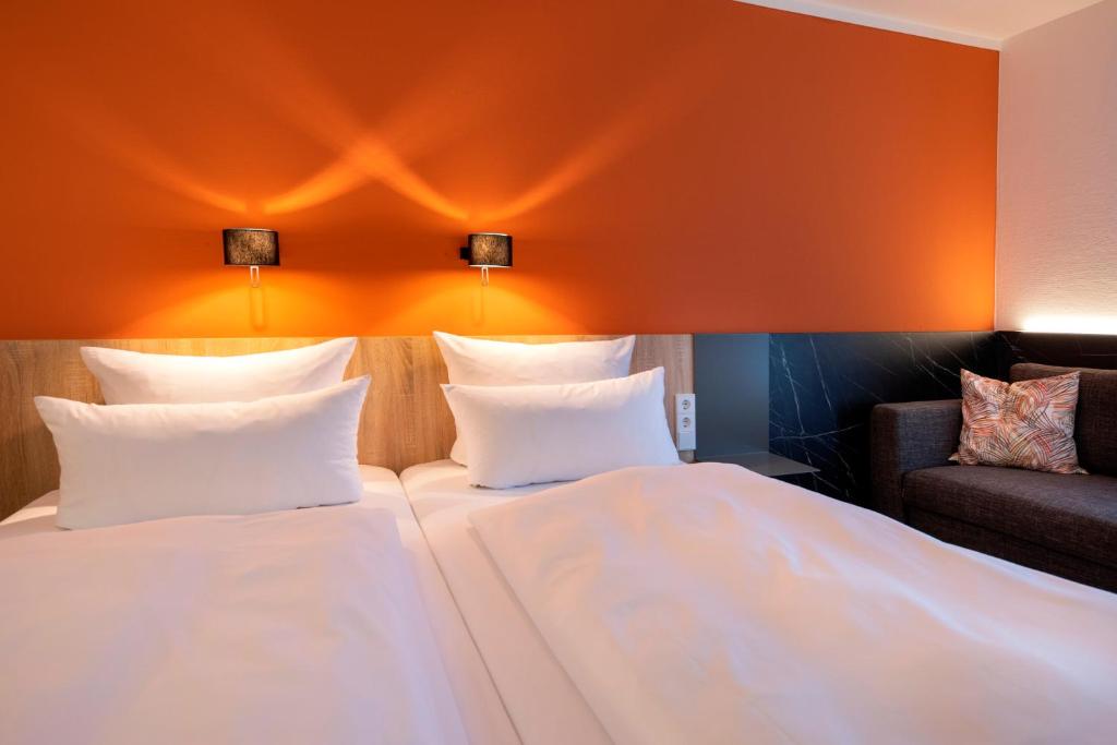 Postel nebo postele na pokoji v ubytování ACHAT Hotel Stuttgart Airport Messe