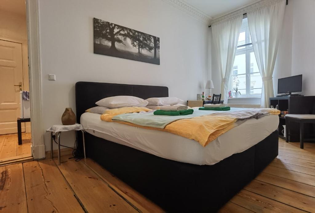 a bedroom with a large bed in a room at APARTMENT - Berlin City Studio in Berlin