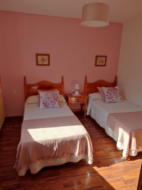 Postel nebo postele na pokoji v ubytování La Salmonera Cangas de Onís