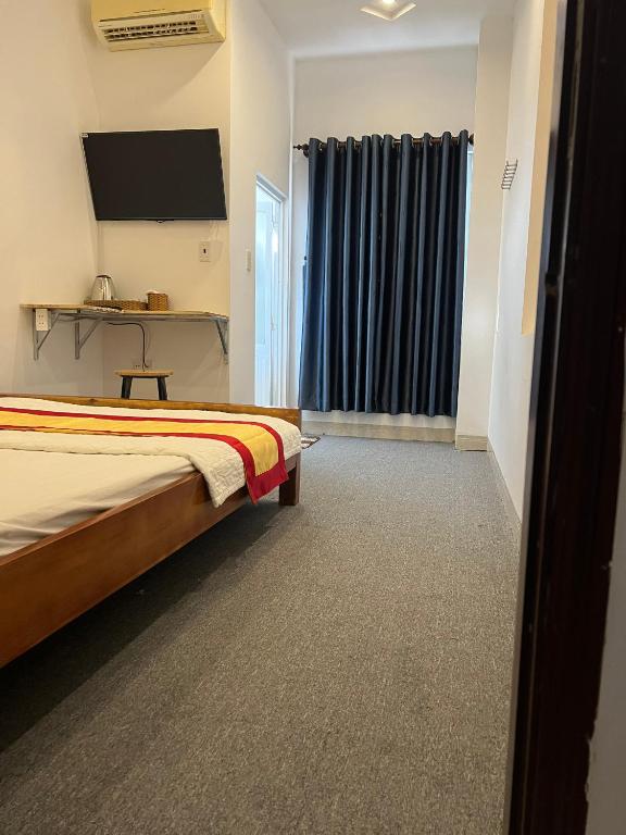 Postel nebo postele na pokoji v ubytování Motel Toàn Thắng