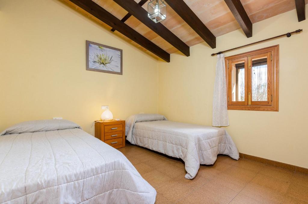 Postel nebo postele na pokoji v ubytování YourHouse Son Bosquer