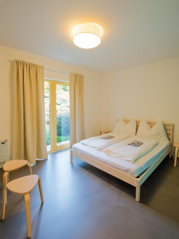 Ένα ή περισσότερα κρεβάτια σε δωμάτιο στο Hostel Zahrada Mikulov