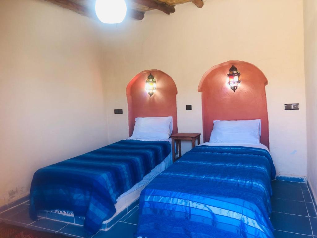 Postel nebo postele na pokoji v ubytování Riad Hotel Les Flamants