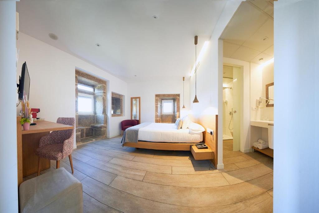 A bed or beds in a room at Hotel Nande