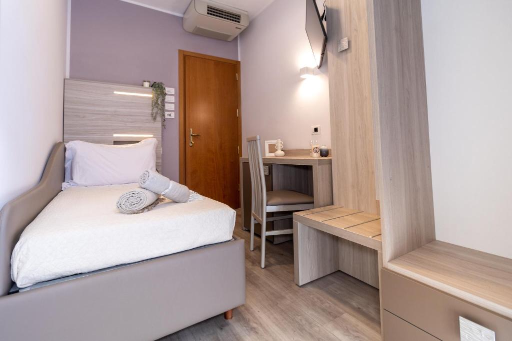 Postel nebo postele na pokoji v ubytování Hotel Alfonsina