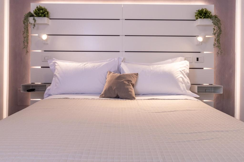 Postel nebo postele na pokoji v ubytování Hotel Alfonsina