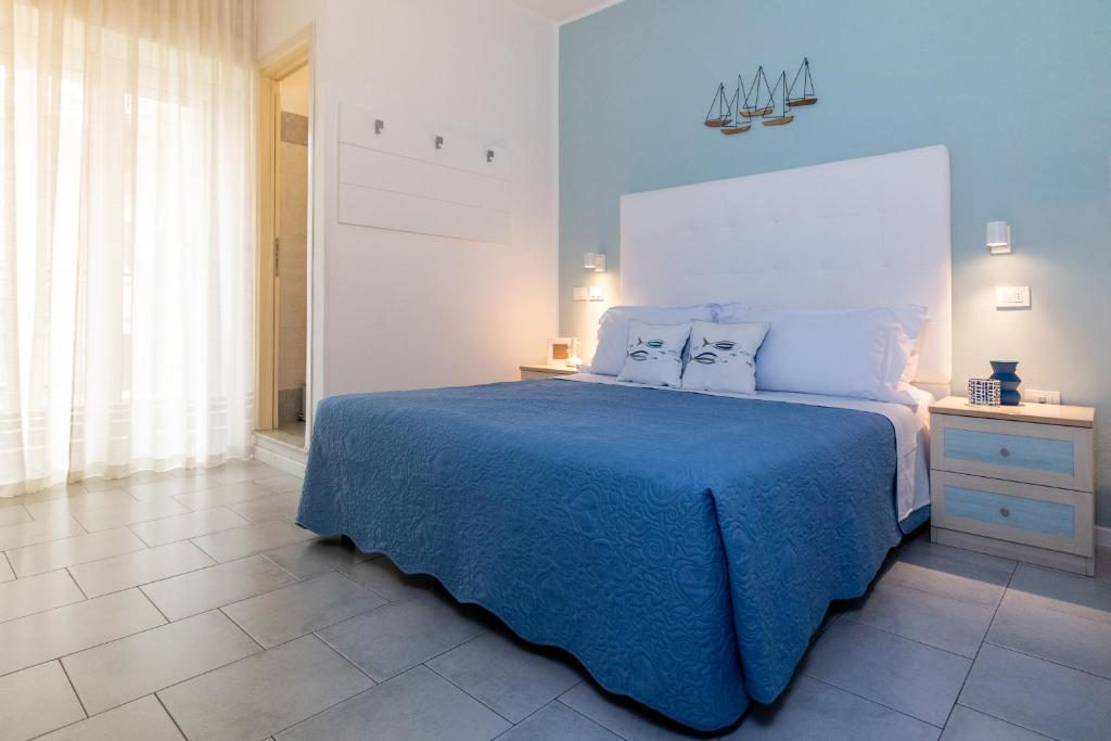 Postel nebo postele na pokoji v ubytování Hotel Alfonsina