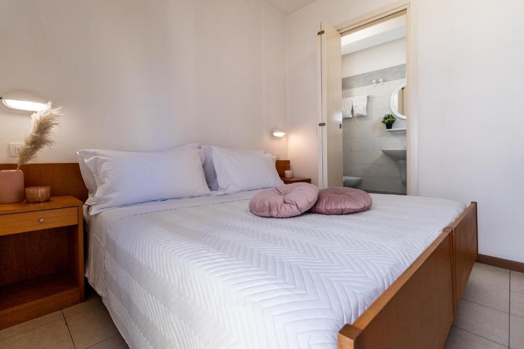 Postel nebo postele na pokoji v ubytování Hotel Alfonsina