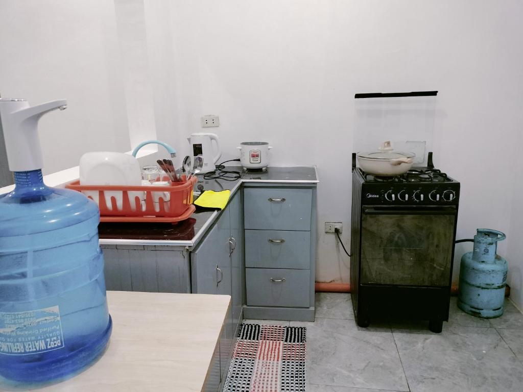 Kuchyň nebo kuchyňský kout v ubytování Bais City Home Staycation