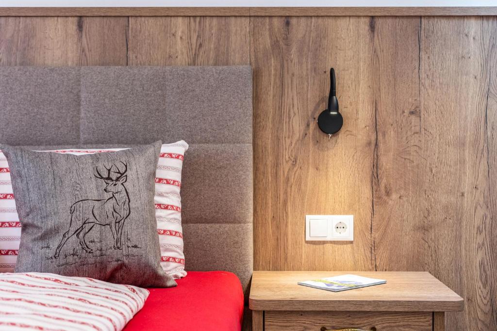 Postel nebo postele na pokoji v ubytování Balbeinhof Apt Hirsch