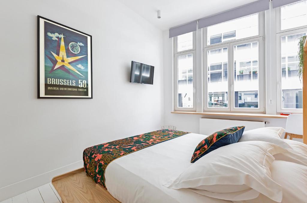 Postel nebo postele na pokoji v ubytování Happy guesthouse - Grand Place