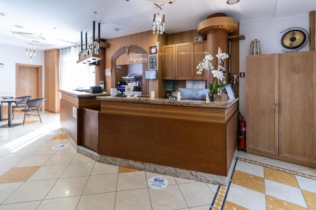 Kuchyň nebo kuchyňský kout v ubytování Hotel Alfonsina