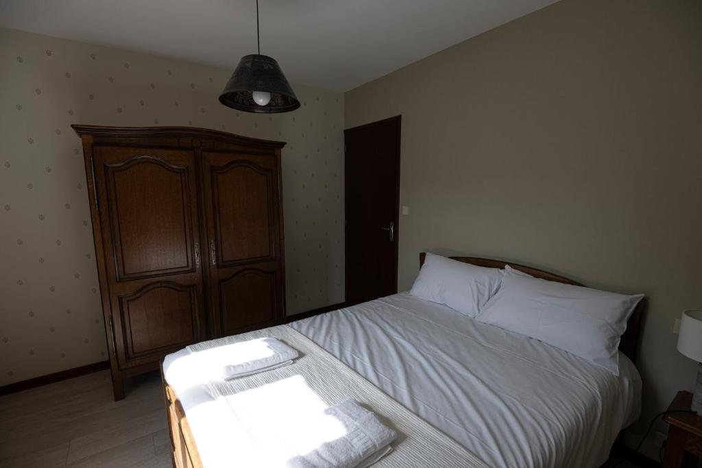 Postel nebo postele na pokoji v ubytování Le Roucadel