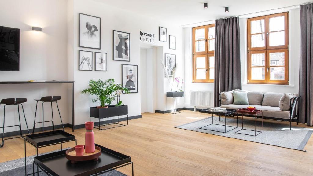 a living room with a couch and a table at ipartment Wolfsburg in Wolfsburg