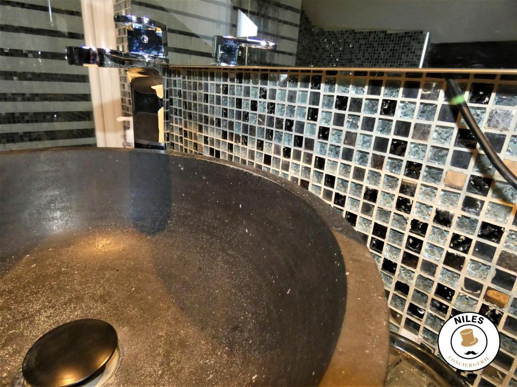 a bathroom with a large metal sink with a spoon at La Caze Paloise ~ Atypique ~ 100% Fonctionnel in Pau