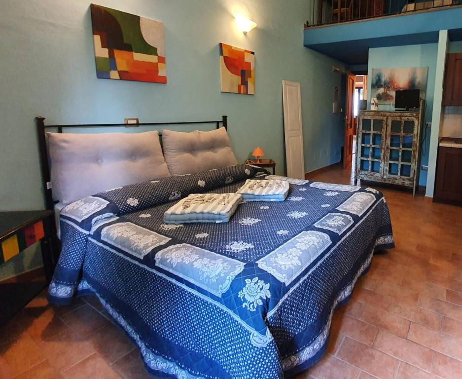 Łóżko lub łóżka w pokoju w obiekcie Bio Agriturismo Valle dei Calanchi