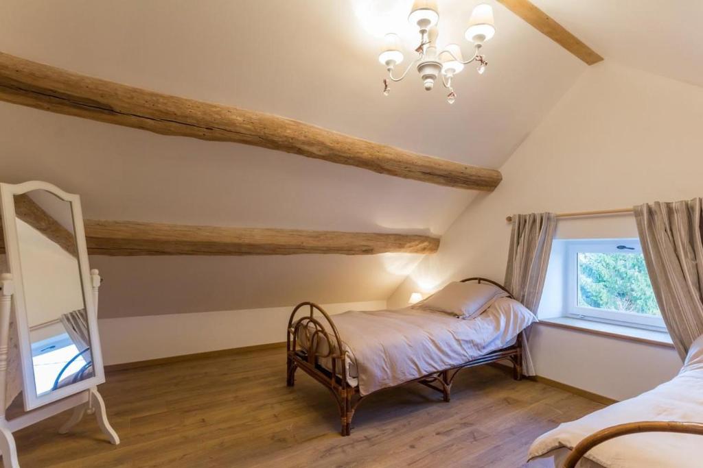 Postel nebo postele na pokoji v ubytování Le Val Sambon