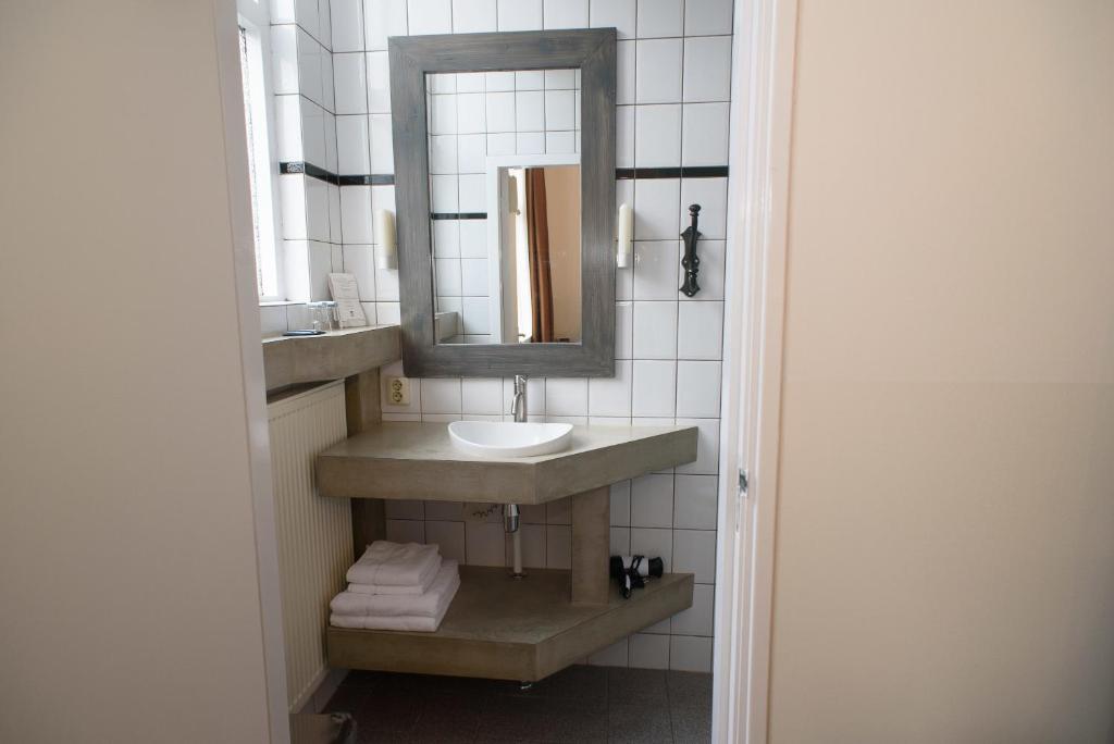 Koupelna v ubytování Hotel Buren