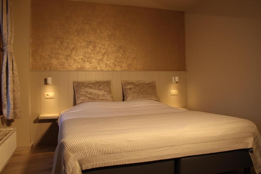 Postel nebo postele na pokoji v ubytování Hotel Rubens