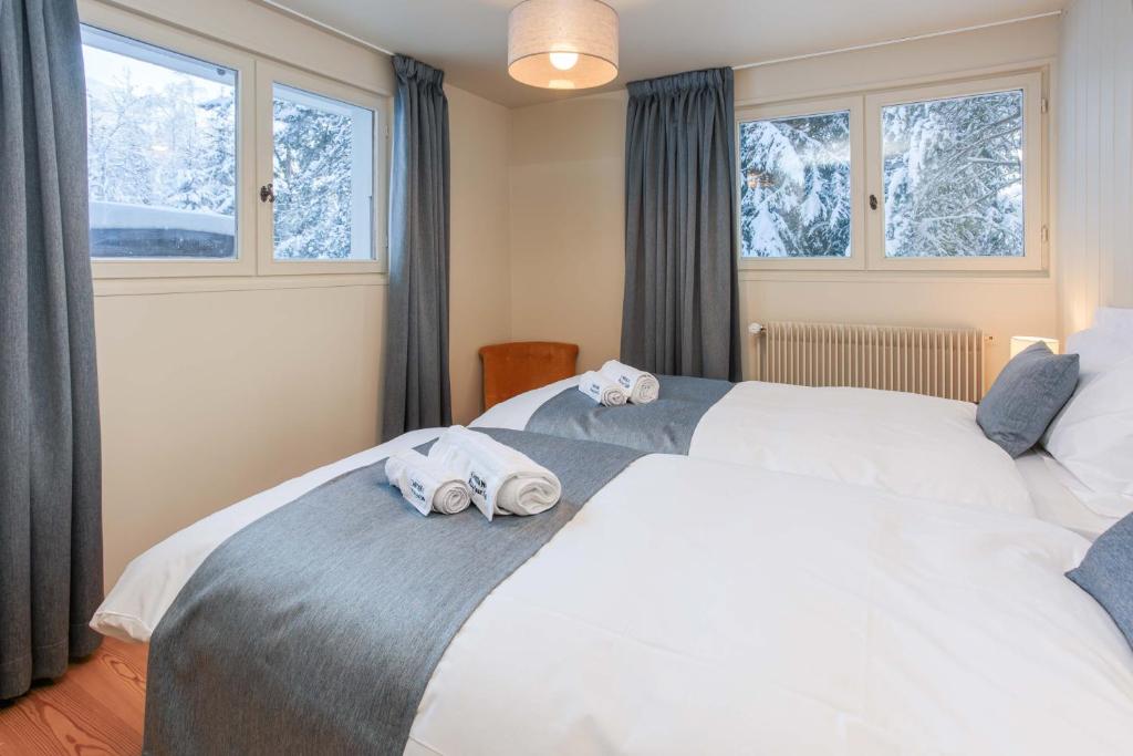 Posteľ alebo postele v izbe v ubytovaní Chalet le Tricouni