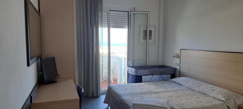 Postel nebo postele na pokoji v ubytování Hotel Marco