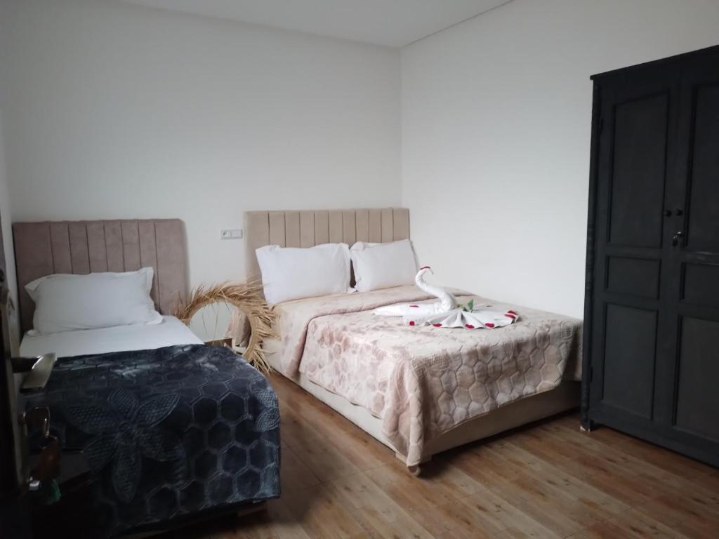 Postel nebo postele na pokoji v ubytování Hôtel Agnaou