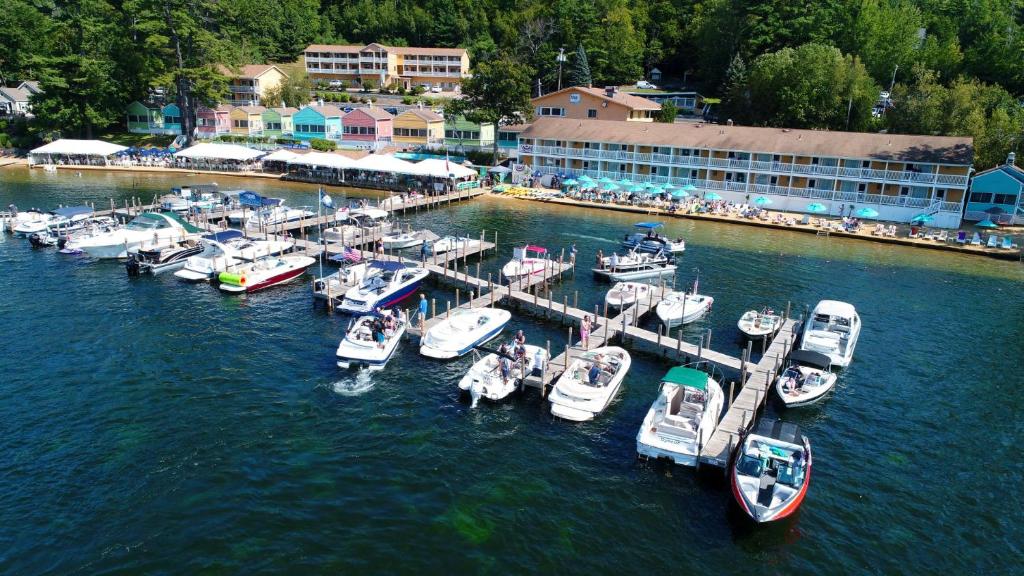 a group of boats docked at a dock in the water at NASWA Resort in Laconia