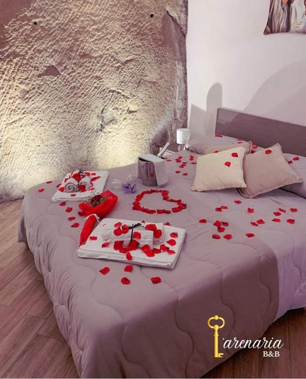 Postel nebo postele na pokoji v ubytování B&B L'Arenaria