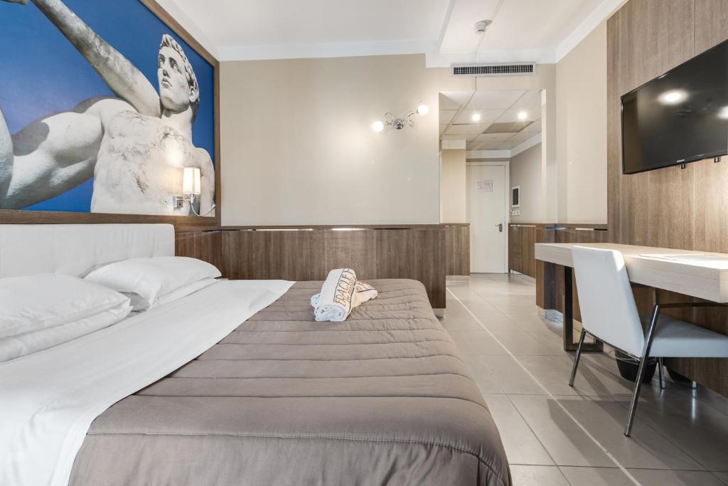 Postel nebo postele na pokoji v ubytování Eracle Hotel