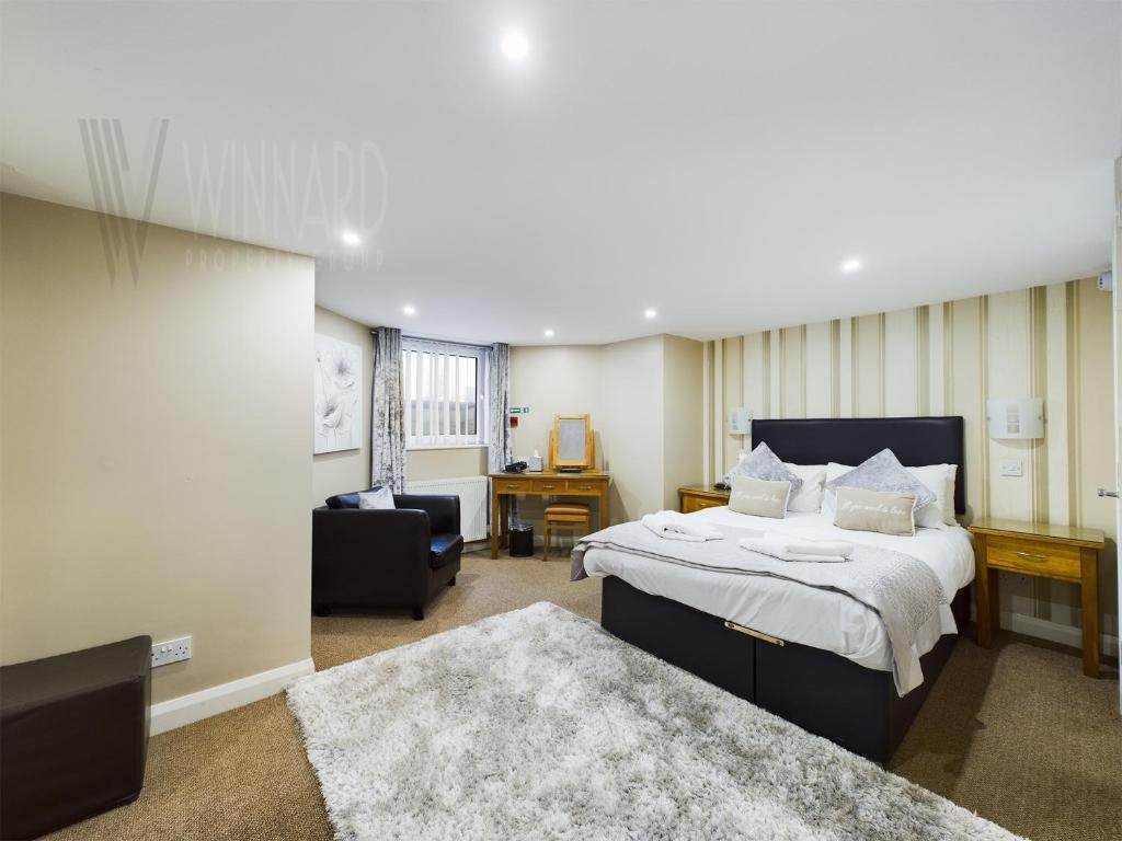 Кровать или кровати в номере The Beach House, Luxury Apartments