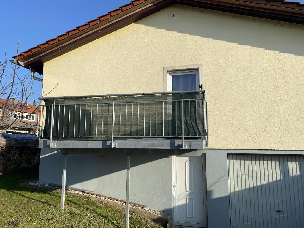 a balcony on the side of a house at Nisas Ferienwohnung in Bad Säckingen
