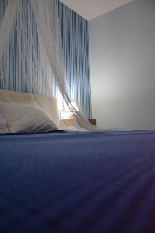 Postel nebo postele na pokoji v ubytování Valente Perlia Rooms