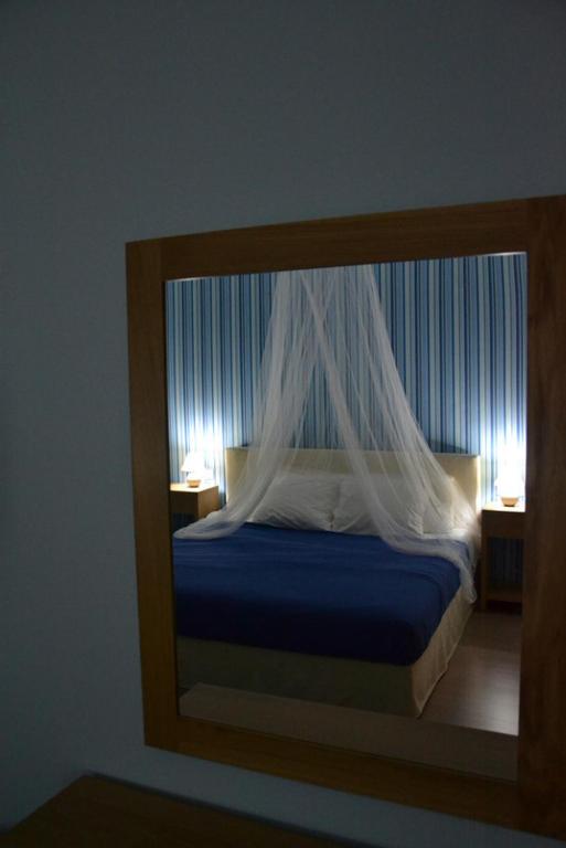 Postel nebo postele na pokoji v ubytování Valente Perlia Rooms