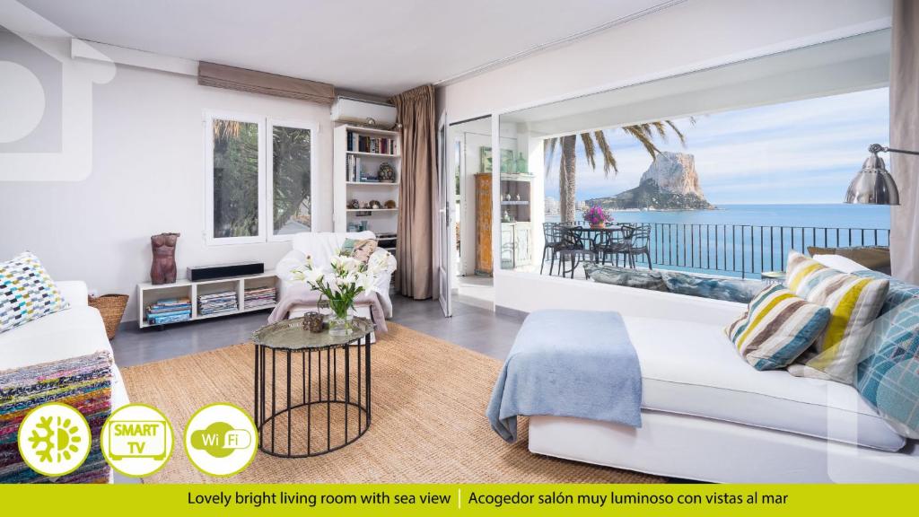 a living room with a view of the ocean at Solhabitat Coll de Mar in Calpe